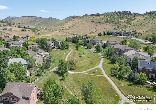 121 Osprey Ln, Lyons, CO 80540 - aerial overview of property's location with nearby suburban area and a mountainous background