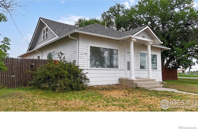 595 E Kiser Ave, Keenesburg, CO 80643 - bungalow-style house with roof with shingles