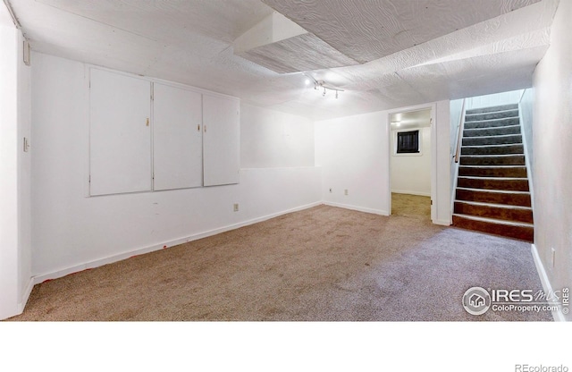 595 E Kiser Ave, Keenesburg, CO 80643 - finished basement with carpet flooring and stairs