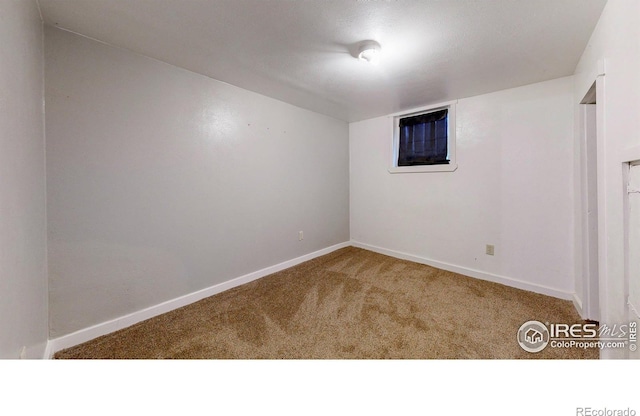 595 E Kiser Ave, Keenesburg, CO 80643 - empty room with carpet flooring and baseboards
