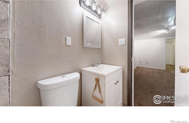595 E Kiser Ave, Keenesburg, CO 80643 - bathroom with toilet and vanity