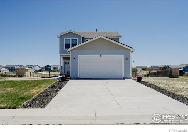 184 S 2nd Ave, Deer Trail, CO 80105 - view of front facade featuring concrete driveway and an attached garage