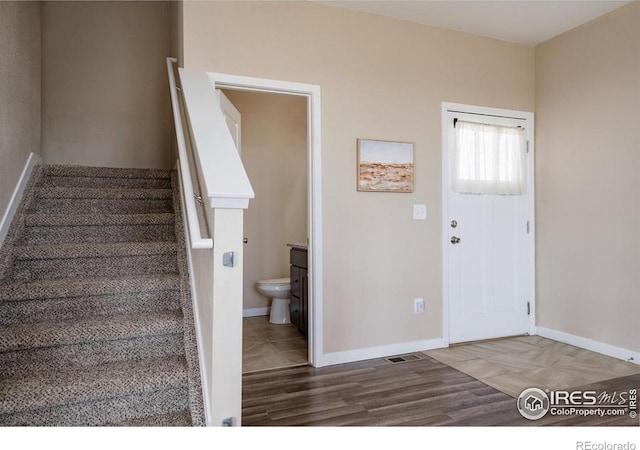 184 S 2nd Ave, Deer Trail, CO 80105 - foyer entrance featuring stairs and wood finished floors