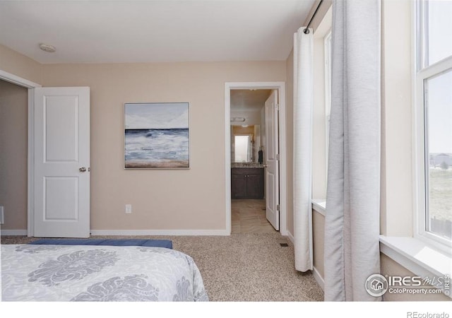 184 S 2nd Ave, Deer Trail, CO 80105 - bedroom featuring carpet floors and connected bathroom