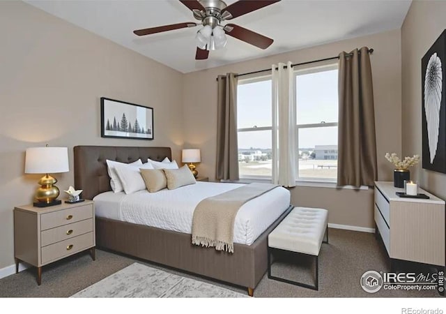 184 S 2nd Ave, Deer Trail, CO 80105 - bedroom with dark colored carpet and a ceiling fan