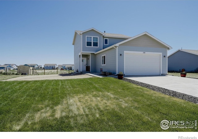 184 S 2nd Ave, Deer Trail, CO 80105 - view of front of house featuring a garage and driveway