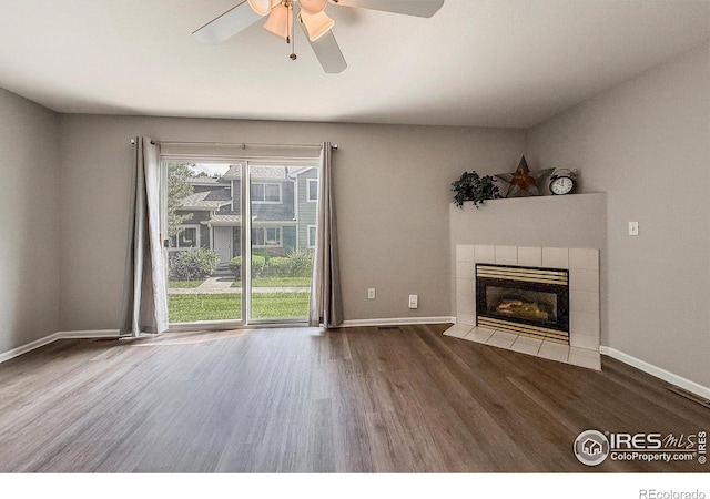 51 21st Ave Unit 43, Longmont, CO 80501 - unfurnished living room with wood finished floors, ceiling fan, and a tiled fireplace