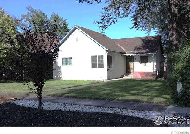 308 Prospect St, Fort Morgan, CO 80701 - view of front of home featuring a front lawn and stucco siding