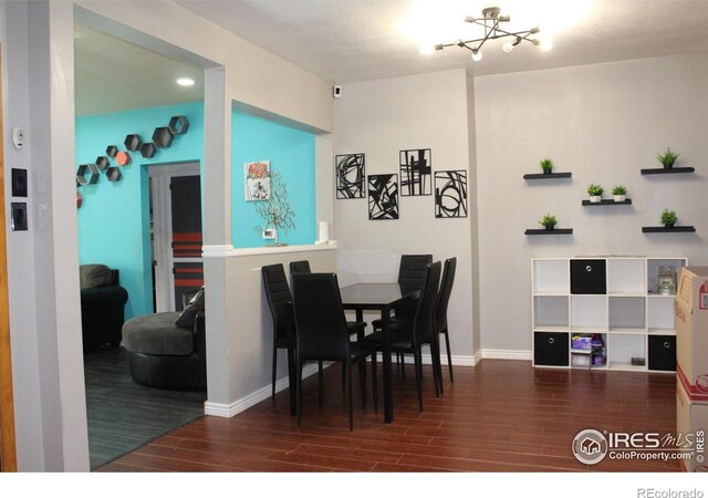 308 Prospect St, Fort Morgan, CO 80701 - dining area with wood finished floors and a chandelier