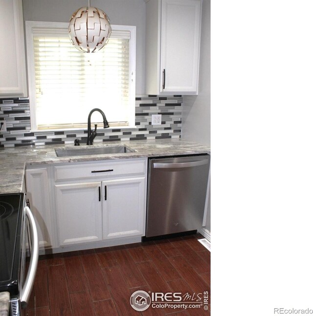 308 Prospect St, Fort Morgan, CO 80701 - kitchen with stainless steel dishwasher, range, white cabinetry, and dark wood-style floors