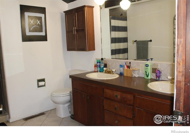 308 Prospect St, Fort Morgan, CO 80701 - bathroom with tile patterned flooring, double vanity, curtained shower, and backsplash