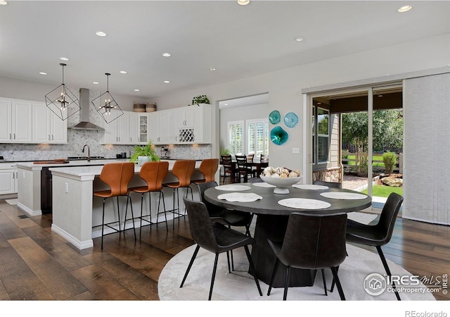 15958 Humboldt Peak Dr, Broomfield, CO 80023 - dining space with dark wood-style flooring and recessed lighting