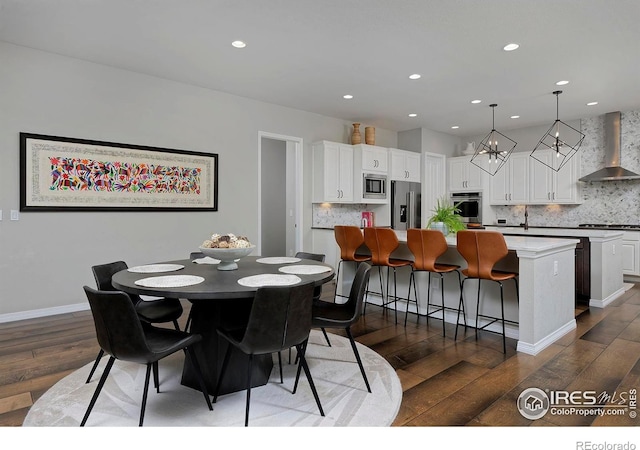 15958 Humboldt Peak Dr, Broomfield, CO 80023 - dining space with dark wood-style flooring, recessed lighting, and a chandelier