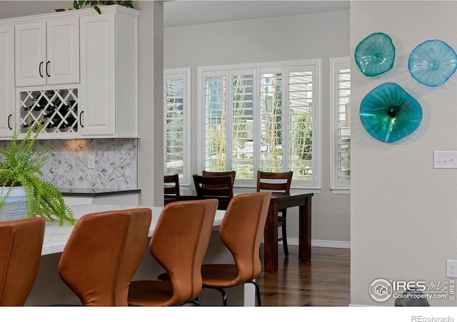 15958 Humboldt Peak Dr, Broomfield, CO 80023 - dining space with dark wood-type flooring and a bar