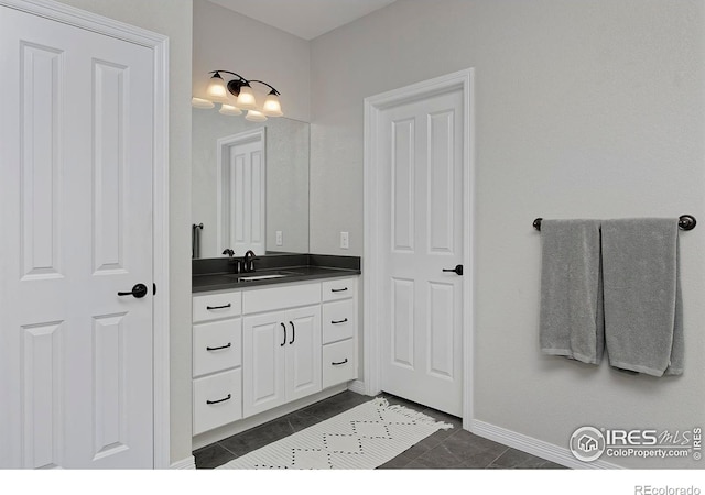 15958 Humboldt Peak Dr, Broomfield, CO 80023 - bathroom with vanity and tile patterned floors