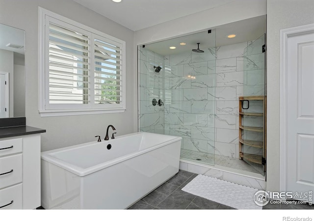 15958 Humboldt Peak Dr, Broomfield, CO 80023 - bathroom with a soaking tub, a marble finish shower, recessed lighting, and vanity