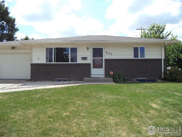 401 31st Ave, Greeley, CO 80634 - ranch-style home with brick siding, a front yard, and an attached garage