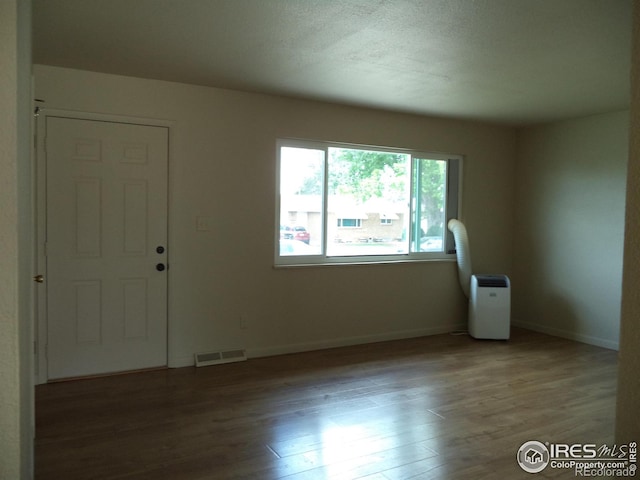 401 31st Ave, Greeley, CO 80634 - spare room featuring wood finished floors and baseboards