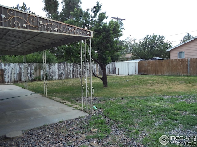 401 31st Ave, Greeley, CO 80634 - fenced backyard featuring a storage unit and a carport