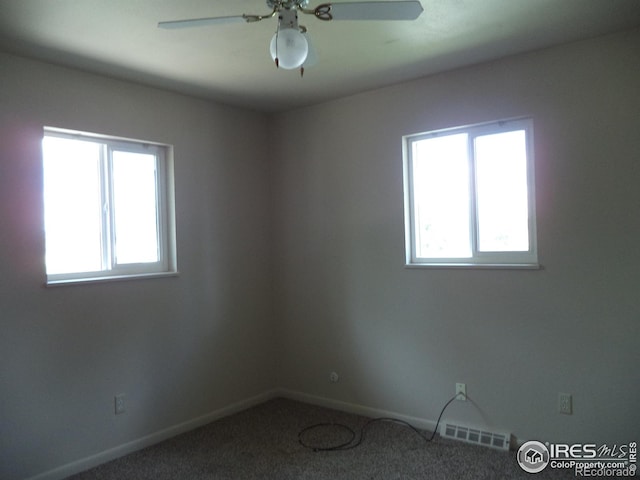 401 31st Ave, Greeley, CO 80634 - unfurnished room featuring healthy amount of natural light, carpet floors, and a ceiling fan