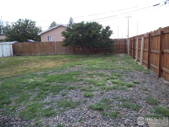 401 31st Ave, Greeley, CO 80634 - fenced backyard featuring a storage shed