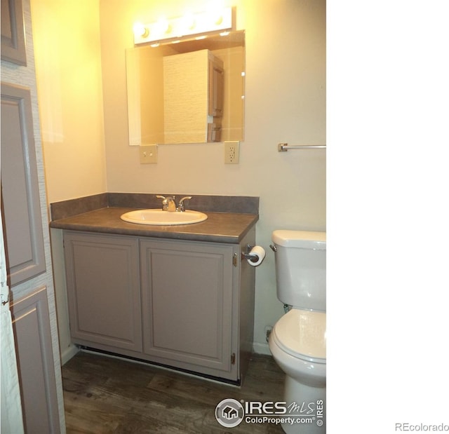 401 31st Ave, Greeley, CO 80634 - bathroom featuring vanity and wood finished floors