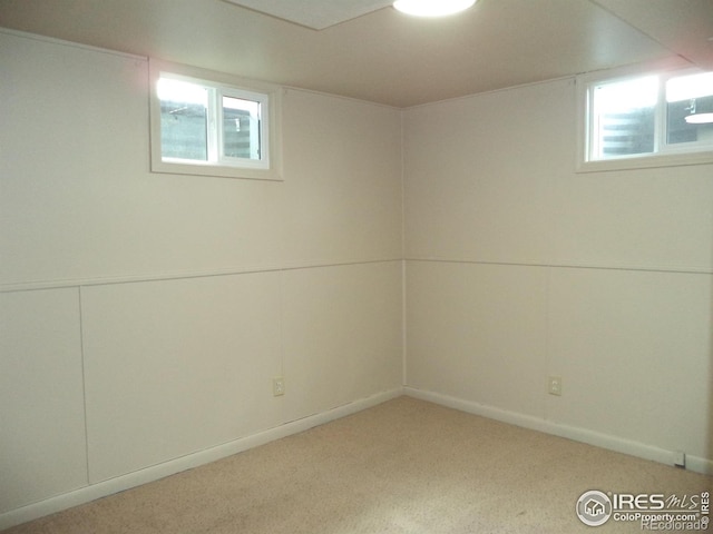 401 31st Ave, Greeley, CO 80634 - below grade area featuring light colored carpet and healthy amount of natural light