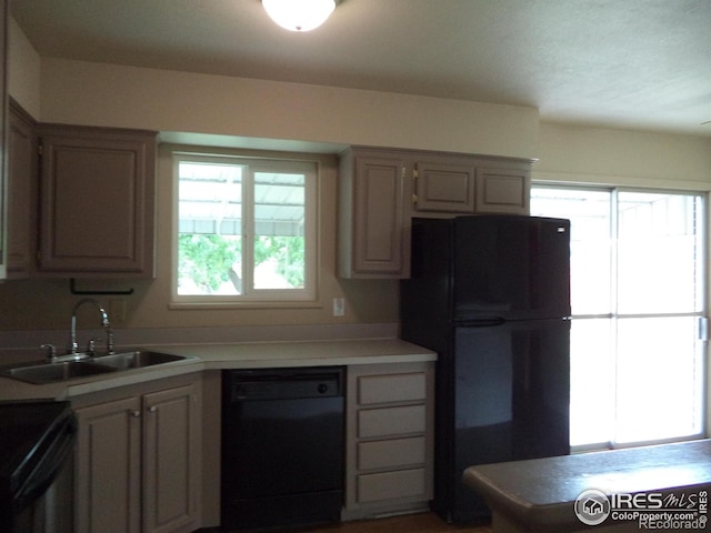 401 31st Ave, Greeley, CO 80634 - kitchen with black appliances and light countertops