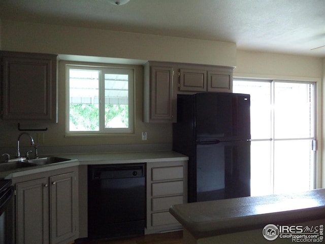 401 31st Ave, Greeley, CO 80634 - kitchen with black appliances and light countertops