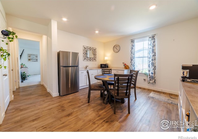 4918 Preserve Pl, Firestone, CO 80504 - dining space featuring light wood-style flooring and recessed lighting