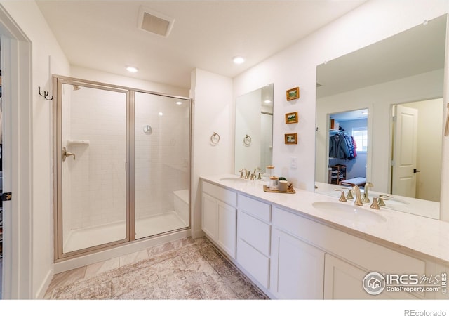 4918 Preserve Pl, Firestone, CO 80504 - full bathroom with a stall shower, a walk in closet, double vanity, and recessed lighting