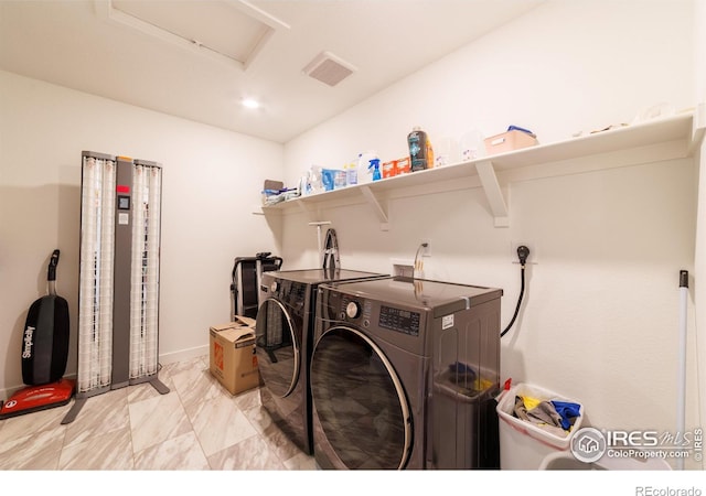 4918 Preserve Pl, Firestone, CO 80504 - laundry room with washer and dryer, attic access, and light marble finish flooring
