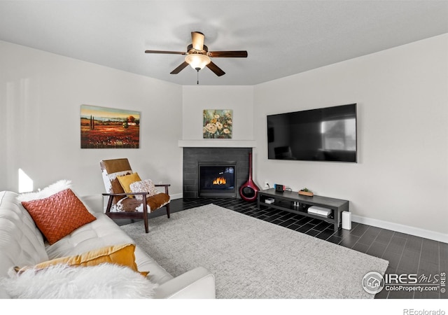 1365 15th Ave, Longmont, CO 80501 - living area with ceiling fan and a fireplace with flush hearth