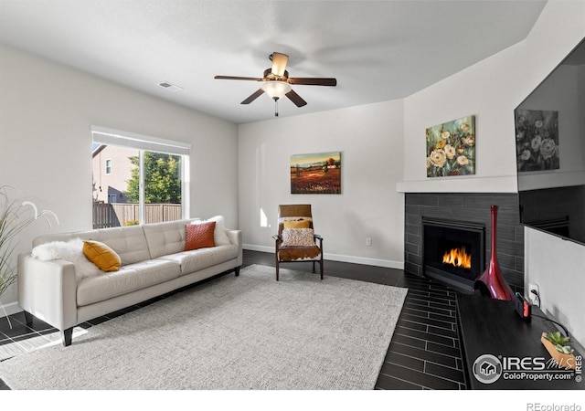 1365 15th Ave, Longmont, CO 80501 - living room with a ceiling fan, dark wood finished floors, and a tile fireplace