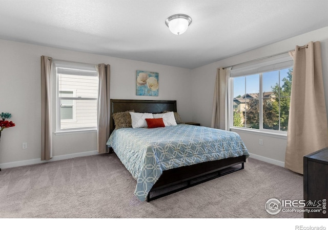 1365 15th Ave, Longmont, CO 80501 - carpeted bedroom featuring baseboards