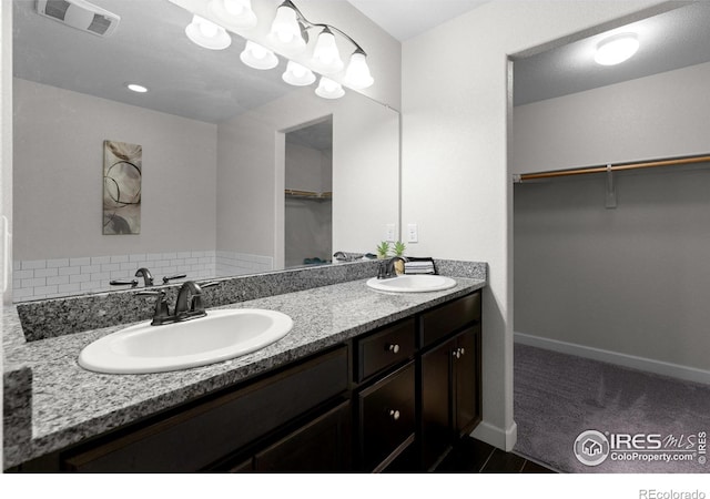 1365 15th Ave, Longmont, CO 80501 - bathroom with double vanity and a walk in closet