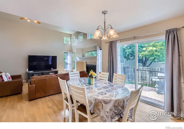 1747 Daisy Ct, Brighton, CO 80601 - dining space featuring a chandelier and light wood-style floors