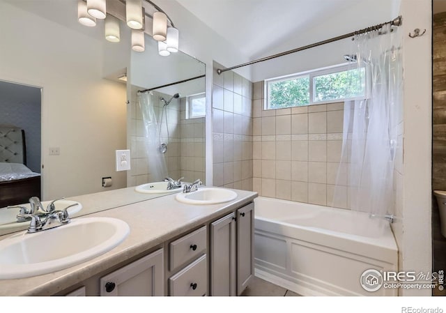1747 Daisy Ct, Brighton, CO 80601 - full bath with shower / bath combo with shower curtain, lofted ceiling, and double vanity