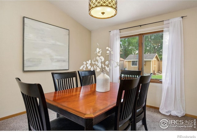 904 Pine Dr, Windsor, CO 80550 - carpeted dining space with baseboards and lofted ceiling