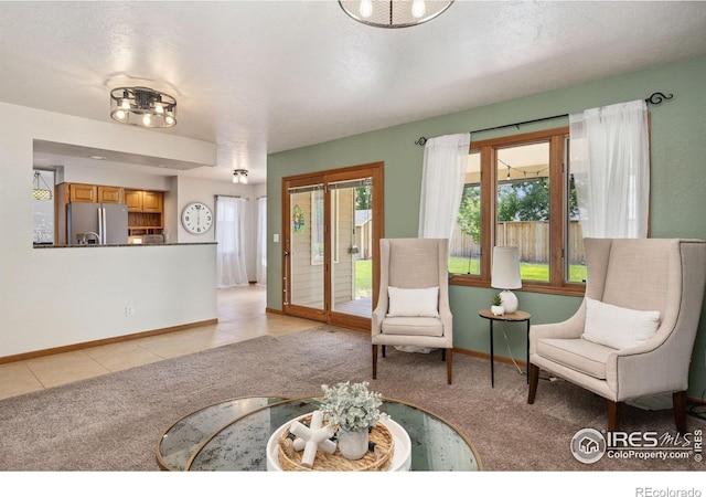 904 Pine Dr, Windsor, CO 80550 - living area with light carpet and light tile patterned flooring