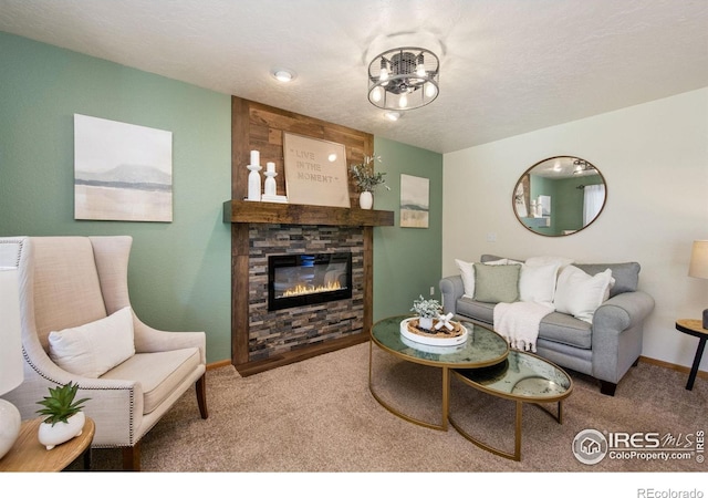 904 Pine Dr, Windsor, CO 80550 - carpeted living room with a stone fireplace and baseboards