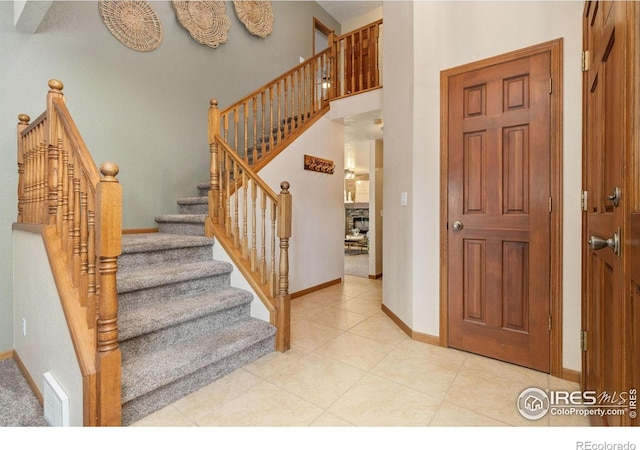 904 Pine Dr, Windsor, CO 80550 - tiled entrance foyer with baseboards and stairway