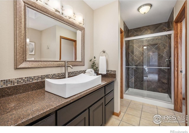 904 Pine Dr, Windsor, CO 80550 - bathroom with vanity, a shower stall, and tile patterned flooring