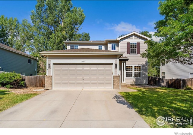 2821 Longboat Way, Fort Collins, CO 80524 - traditional-style house with brick siding, concrete driveway, and an attached garage