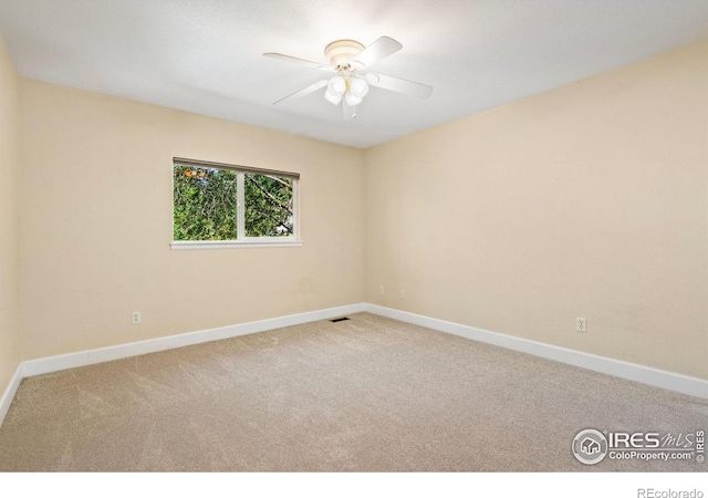 2821 Longboat Way, Fort Collins, CO 80524 - carpeted spare room with baseboards and ceiling fan