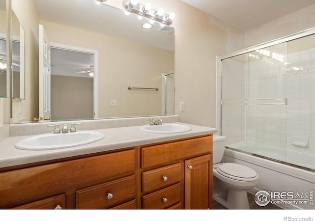 2821 Longboat Way, Fort Collins, CO 80524 - full bathroom featuring double vanity, enclosed tub / shower combo, and a ceiling fan