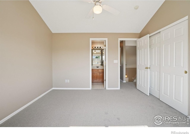 1506 Crestwood Cir, Longmont, CO 80504 - unfurnished bedroom with light colored carpet, a closet, connected bathroom, and vaulted ceiling