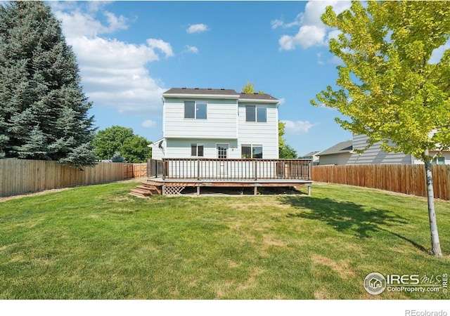 1506 Crestwood Cir, Longmont, CO 80504 - back of property featuring a fenced backyard and a wooden deck