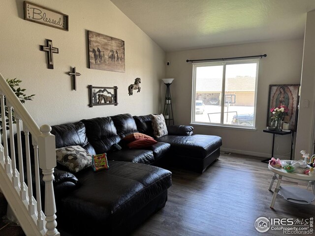 3315 W 35th St, Greeley, CO 80634 - living room with wood finished floors, lofted ceiling, and stairway