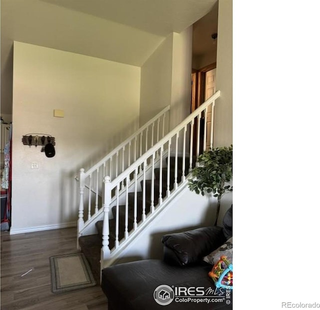 3315 W 35th St, Greeley, CO 80634 - stairway with wood finished floors and baseboards